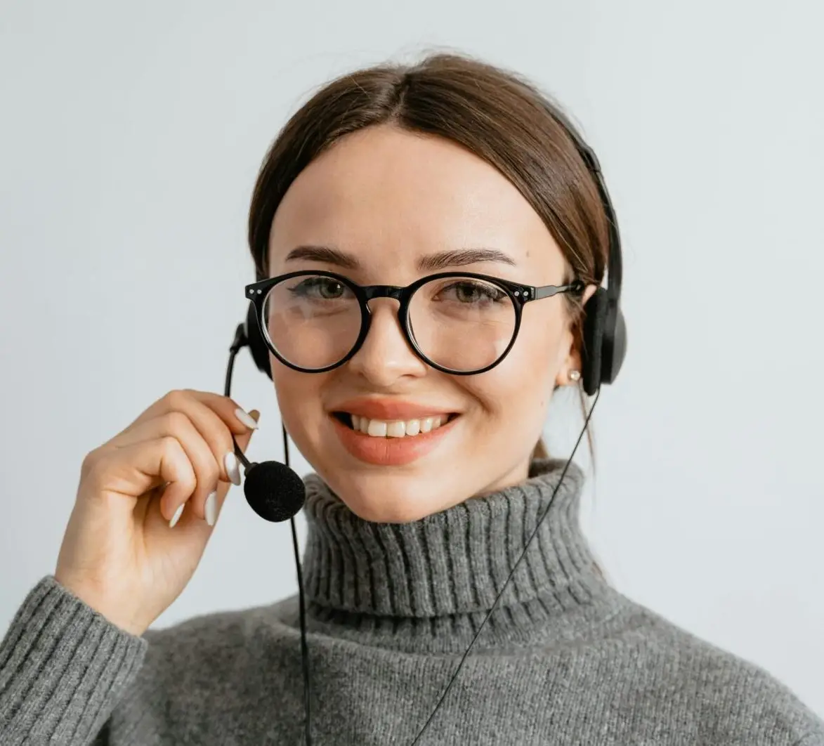 Woman in Gray Turtle Neck Shirt with Black Headset and Mouthpiece